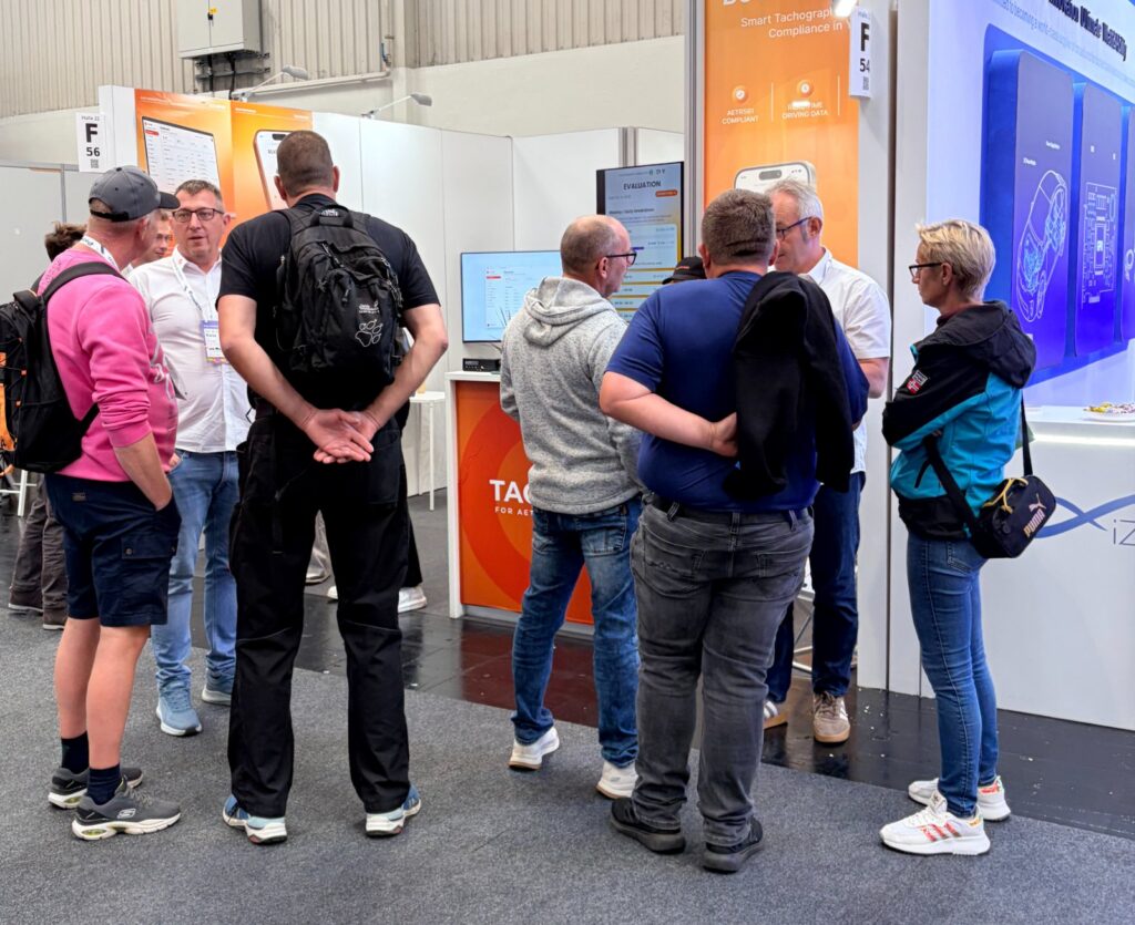 A group of visitors at the Tacho561 counter